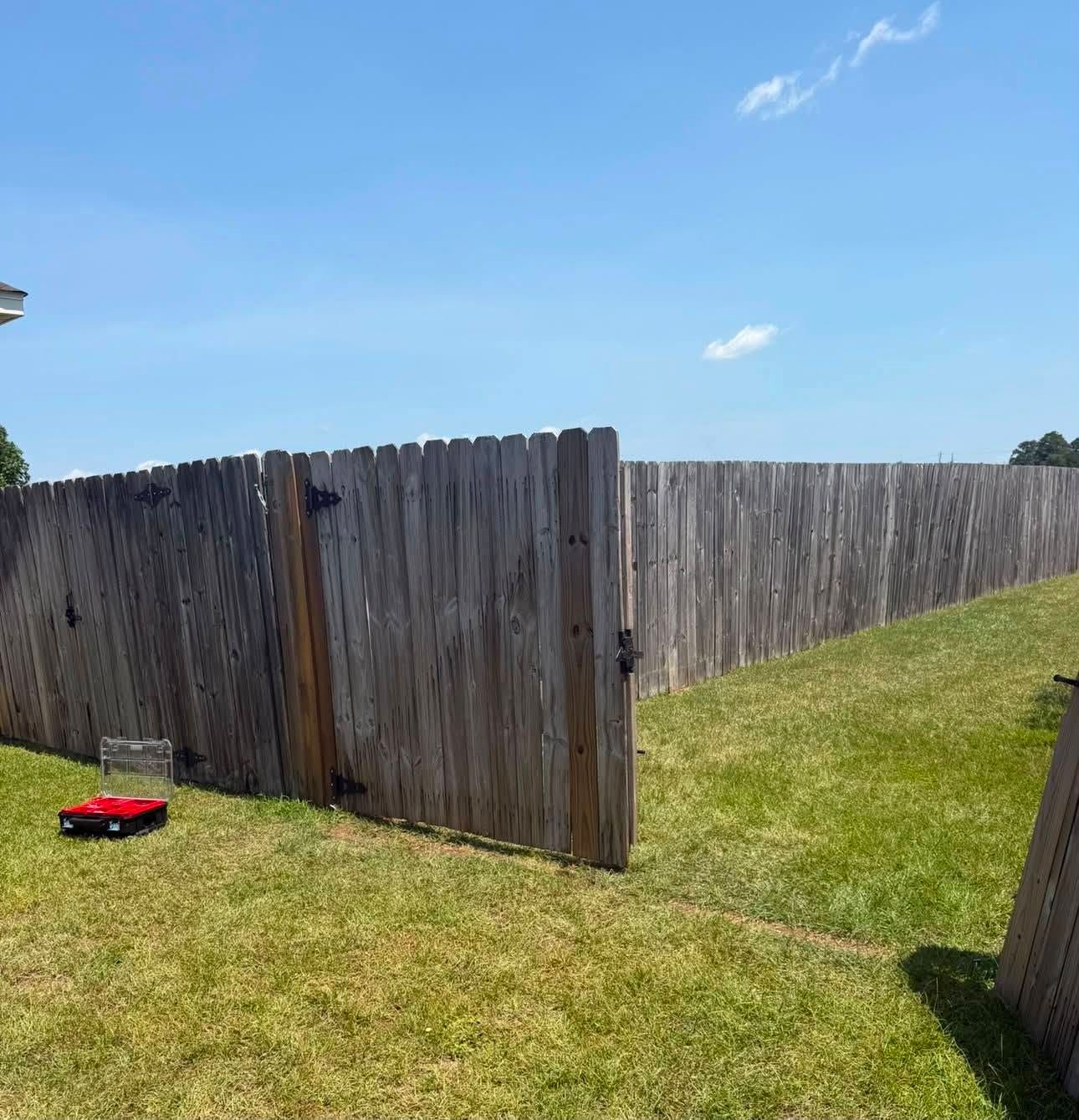 After: the fence gate rehung, closed and square
