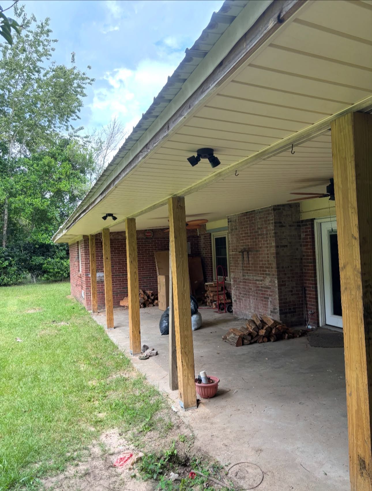 After: finished white vinyl soffit running the length of the back porch